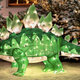 Illustration for article titled A Lightup Stegosaurus Is Just What Your Lawn Nativity Scene Needed